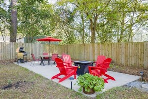 backyard amenity area with gas grill and firepit