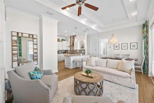 Unwind in a stylish living space with plush seating, elegant decor, and natural light pouring in.