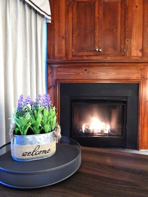 "Fireplace","Indoors","Hearth","Flower","Flower Arrangement"