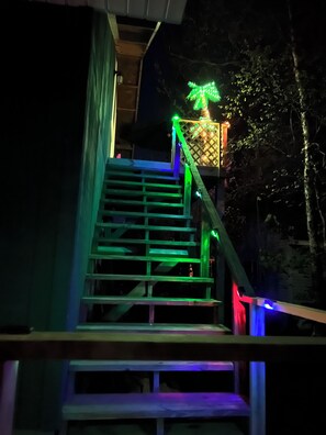 Stairs to the apartment and deck behind the garage