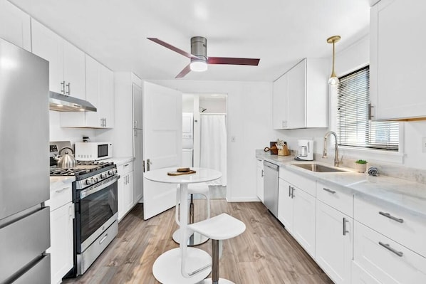 Full size kitchen with full size appliances and marble countertops!