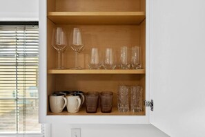Fully stocked with all glassware, dishware, and cookware!