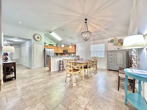 Open concept living, dining and kitchen. Seating for 8 at table and 4 at counter.
