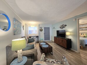 Open Living Room with designated work desk and smart tv