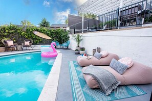 Unwind by the poolside with comfortable outdoor seating. The perfect spot for basking in the sunshine.