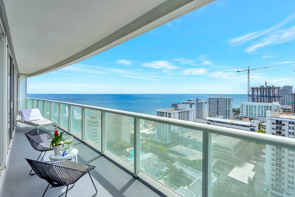Private Balcony | Ocean view with a conversation seating area.