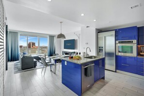 Layout | Modern, open-concept living space, balcony access, and windows galore.