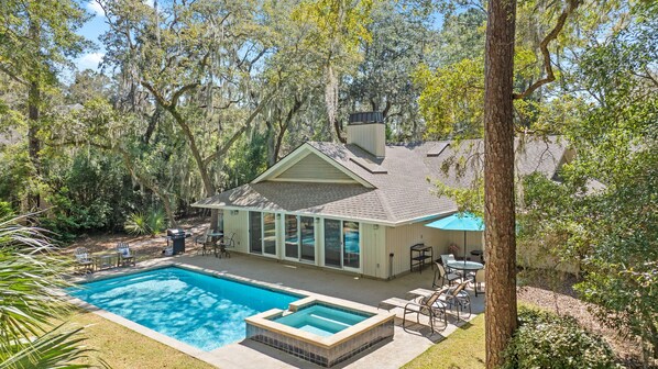 Backyard with private pool, spa, grill and seating area