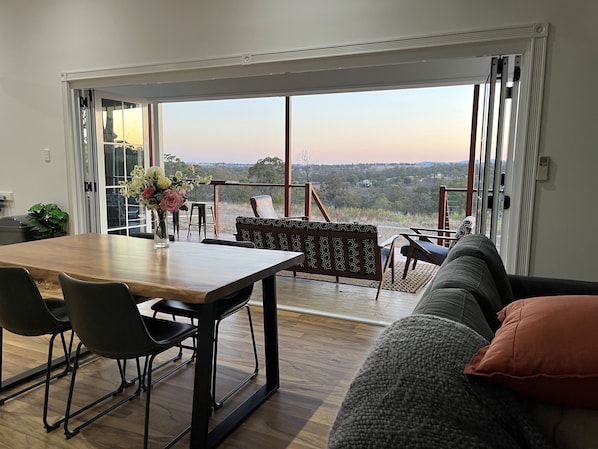 View from dining area to deck through the beautiful french bifold doors