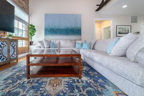 Comfortable seating in the living room. Roku TV allows guests to stream their favorite shows.