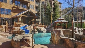 A view over the wonderful pool area where you will find two hot tubs, a wading pool, and a heated pool with a slide.