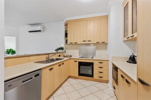 Cook and gather in our fully equipped kitchen, designed for comfort and convenience—perfect for preparing meals and creating memories during your Cairns stay