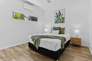 Rest easy in the second bedroom, featuring a cozy queen-size bed—your peaceful retreat for a restful night's sleep