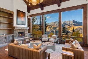 Enjoy the stunning great room with expansive views and a wood burning fireplace