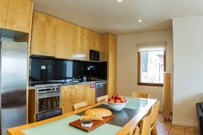 Cooking up some seaside delights in this simply charming kitchen.