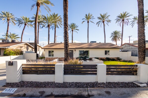 Your stunning Scottsdale getaway, surrounded by palm trees.