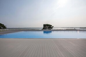A stunning infinity pool overlooking the horizon, creating a serene and relaxing environment.

