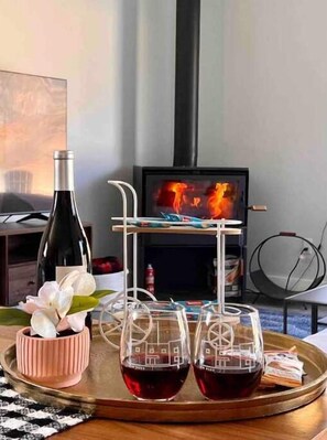 Enjoy a glass of local wine by the fire. 