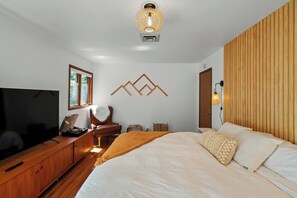 Master bed w/King bed, custom woodwork, Master bath, private patio, 65" smart TV and small walk-in closet
