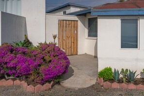 Side entrance to back fenced private patio.