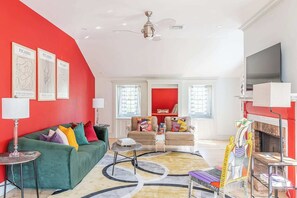 Our living room is designed for your comfort and relaxation. Sink into our sofa, where soft luxury envelops you.  Read a book, catch up with friends, or simply enjoy some peaceful moments, this is the  setting to do so.  Fireplace is non-working.