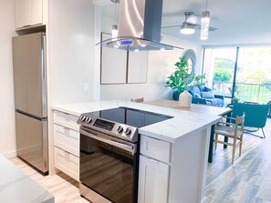 Fully equipped kitchen with coffee maker,  kettle, toaster, blender, rice cooker