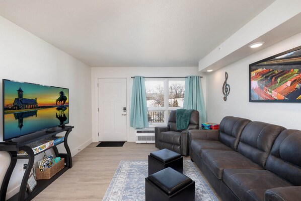 Beautifully decorated living area with streaming tv and queen sofabed