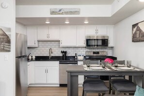 Prep and cook in the fully equipped kitchen with all the standard major appliances – refrigerator, stove/oven, microwave, and dishwasher