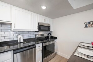 Prep and cook in the fully equipped kitchen with all the standard major appliances – refrigerator, stove/oven, microwave, and dishwasher
