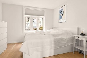 The bedroom features a spacious and comfortable 180cm bed, along with ample space in the drawers for storing your luggage. Welcome to a restful night's sleep!