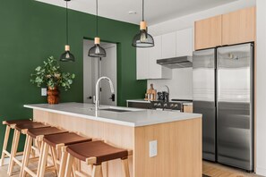 Kitchen with island seating for dining and coffee