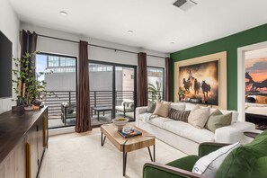 Living room with large windows with natural lighting and western gorgeous decor