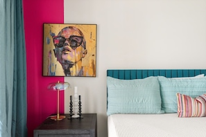 King bed and spacious layout, featuring large windows that flood the room with natural light. Adjacent to the extra-large bathroom, providing convenience and privacy for guests.