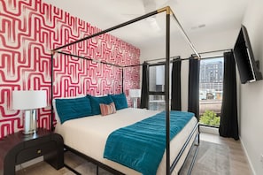 1st bedroom: King bed with a walk-in closet, offering plenty of storage space. The room is designed for comfort and relaxation, with soft lighting and elegant furnishings.