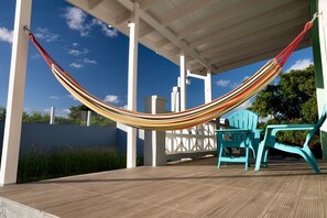 Private Patio away from the street. Kick back on the hammock for some downtime