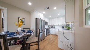 Dining Table Seats Four, Kitchen Opens to Living Room