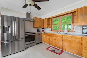 This updated kitchen combines functionality and aesthetics making it an inviting space for your culinary adventures.