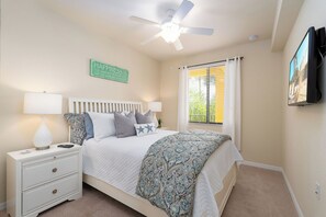 Guest Bedroom - with queen bed, TV and adjacent bathroom.