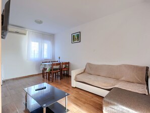 Table, Couch, Property, Furniture, Wood, Window, Interior Design, Picture Frame, Lighting, Living Room