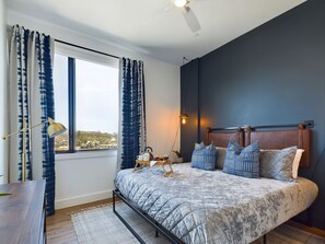 Unit 2: Primary bedroom with a King bed. walk-in closet and en-suite bathroom.