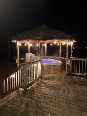  Enjoy the hot tub under the lit gazebo.