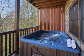 A large, private hot tub is located on the lower deck.