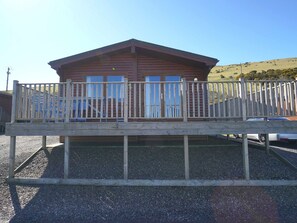 Sky, Wood, Building, House, Fence, Shade, Facade, Baluster, Composite Material, Roof