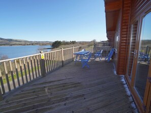 Sky, Water, Wood, Body Of Water, Tree, Porch, Shade, Building, Fence, Outdoor Furniture