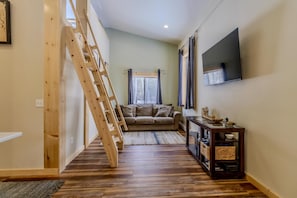 Living room, ladder to loft area