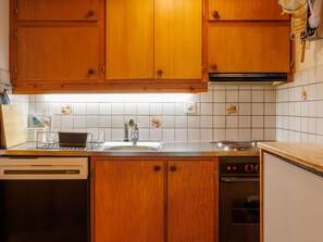Kitchen, Countertop, Kitchen Appliance, Cabinetry, Major Appliance, Wood, Interior Design, Flooring, Kitchen Sink, Sink
