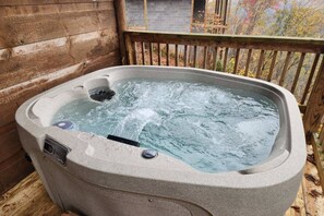 Soak in the beauty of the Smoky Mountains at Bearfoot Lodge. Enjoy wooded & mountain view in this brand new hot tub!