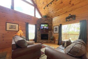 At Bearfoot Lodge the living room boats a gas fireplace, sleeper sofa, and loveseat, and Roku TV for streaming!