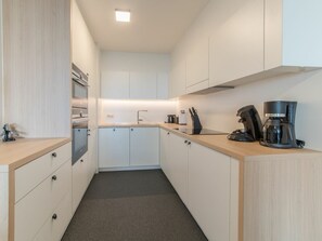 Cabinetry, Furniture, Building, Countertop, Kitchen Appliance, Kitchen, Wood, Drawer, Kitchen Stove, Architecture