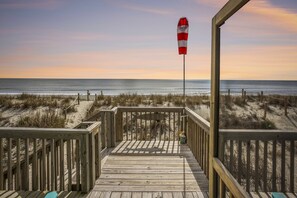 Enjoy a peaceful evening watching the sunset from the porch by the beach.